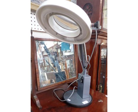 AN INDUSTRIAL-STYLE MAGNIFYING LAMP WITH ADJUSTABLE STAND