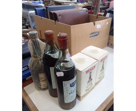 A BOTTLE OF 'SHORT'S BRANDY', 1929 and 1934, a bottle of 'Delamain &amp; Co Cognac fine Champagne 1920' and three Bell's whis