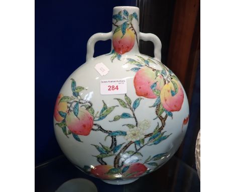 A CHINESE 'MOON FLASK' VASE, decorated with peaches, with character mark to the base, 32.5cm high