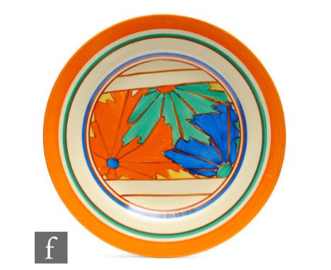 Clarice Cliff - Umbrellas - A circular side plate circa 1930, hand painted with a central panel of starburst motifs within or