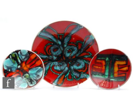 Poole Pottery - A shape 3 Delphis shallow dish, decorated with an abstract blue motif over a red ground, printed mark, diamet
