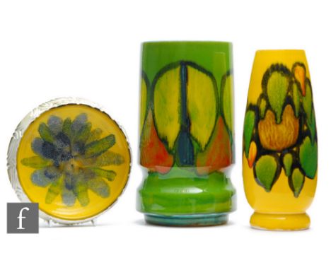 Poole Pottery - A shape 84 Delphis vase, decorated with an upper band of abstract patterns over a green ground, together with