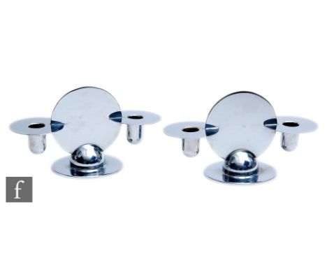 Chase - A pair of American Art Deco chrome plated twin light squat candelabra, circular bases below central plain disc suppor