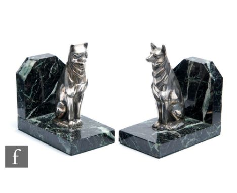 Unknown - A pair of French Art Deco silvered art metal bookends, circa 1925, the first modelled as a stylised seated dog and 
