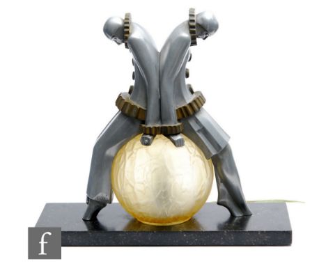 EXE - An Art Deco aluminium and brass Pierrot figural table lamp, with two Pierrot clowns with stooped heads sat on a crackle