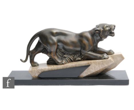 Unknown - A French Art Deco bronzed spelter figure modelled as a panther in hunting pose, raised on a sloping sectional marbl