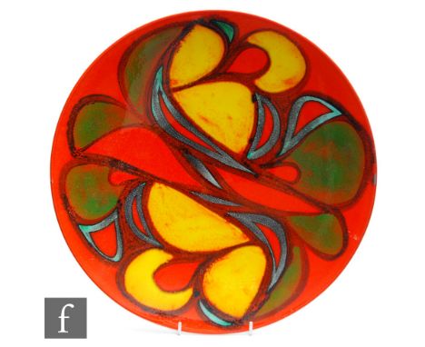 Poole Pottery - A shape 5 Delphis charger, decorated with a yellow green and blue abstract motif over an orange ground, print