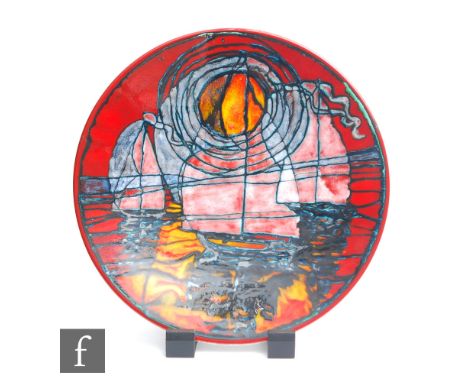 Tony Morris - Poole Studio - A later 20th Century pottery charger decorated with sailing boats against a red sunset sky, prin