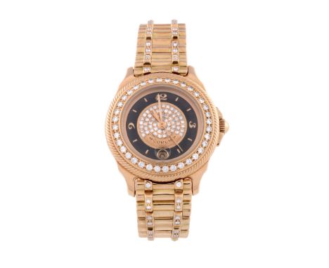  Corum, ref. 39.311.65 V067, an 18 carat gold and diamond bracelet wristwatch,   no. 586956, Swiss quartz movement, 7 jewels,