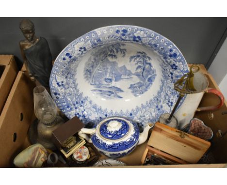 A large blue and white water dish, a vintage enamel jug with red handle, a small vintage oil lamp, a Soul Journeys Maasai fig