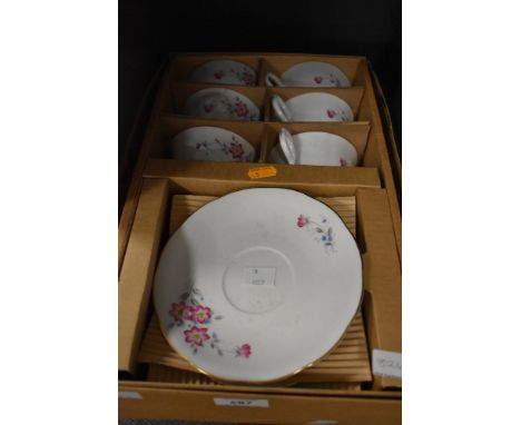 A part tea service in original box with gilt edging and pink floral design having 12 pieces.