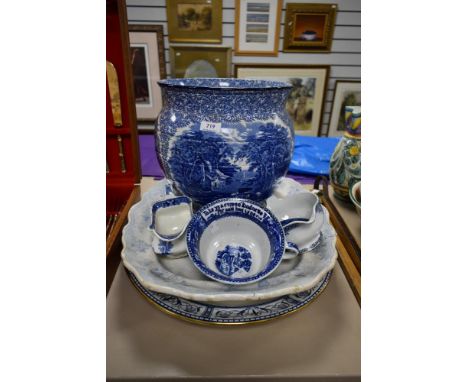 A selection of blue and white ware items including a large planter and two large serving platters etc.