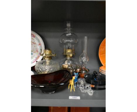A vintage clear glass oil lamp having spotted glass base, a similar pressed glass oil lamp base, three art glass bowls and a 
