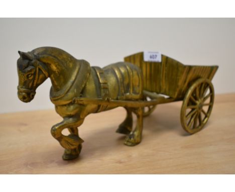A heavy vintage brass horse and cart figurine.