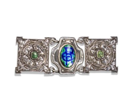 An Arts & Crafts silver belt buckle by Ramsden & Carr, the shield-shaped centre section mounted with an enamel monogram E*C*R