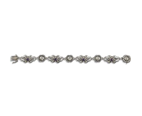 A silver and amethyst bracelet by Georg Jensen, design no.18, c1933-1944, designed as alternating flower heads and scrolling 