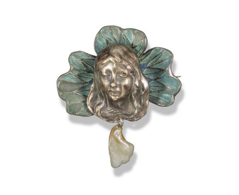 An Art Nouveau silver and enamel brooch, c1900, the nymph's head set within blue plique-à-jour enamel flower surround, stampe