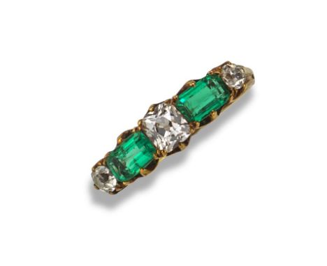 An emerald and diamond five-stone ring by Child & Child, c1900, alternately-set with emerald-cut emeralds and cushion-shaped 