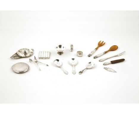 A collection of silver items by Georg Jensen, including an Art Nouveau tea strainer with foliate decoration overall and pierc