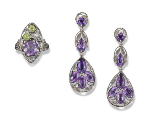 An Arts & Crafts silver and gem-set ring and earrings, c1920, the navette-shaped ring set with two peridots and an amethyst w