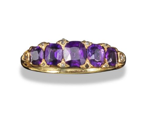 An amethyst five-stone half-hoop ring, the graduated oval-shaped amethysts are set in yellow gold with rose-cut diamonds, siz