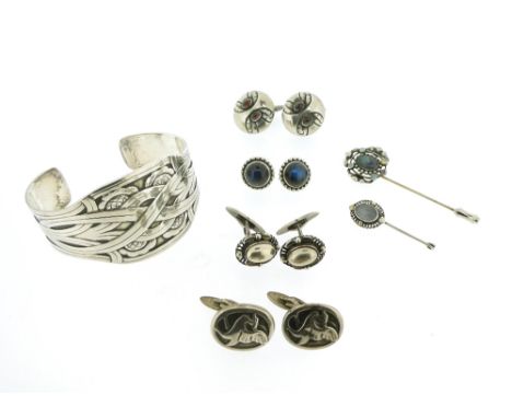 A collection of jewellery items by Georg Jensen, including a silver cuff bangle, design no. 55 by Harald Nielsen, post-1945, 