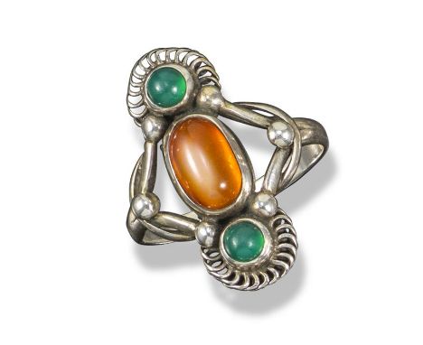 A gem-set silver ring by Georg Jensen, design no. 15, c1909-1915, vertically set with an amber and two green agate cabochons 