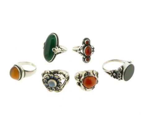 A collection of gem-set silver rings by Georg Jensen, including a moonstone and silver foliate ring, design no. 10, post-1945
