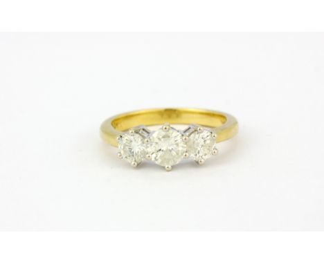 An 18ct yellow gold trilogy ring set with three brilliant cut diamonds, approx. 1ct overall, (K).