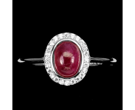 A 925 silver cluster ring set with a cabochon cut ruby and white stones, (S).