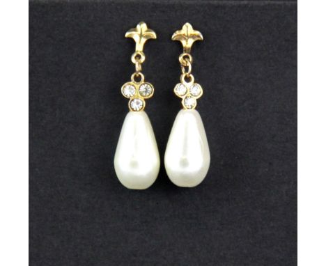 A pair of yellow metal (tested minimum 9ct gold) pearl drop earrings, L. 2.5cm.