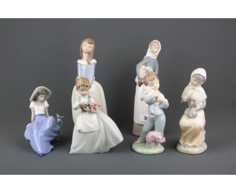 Five Nao porcelain figurines with a Lladro figurine of a girl with a lamp, tallest H. 28cm.