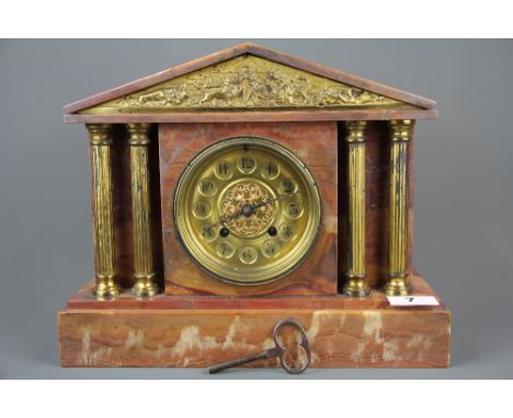 A 19th/ early 20th C pink marble and gilt mantle clock, H.27cm x W.32cm.