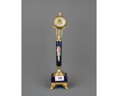 A German gilt metal decorative clock, H. 34cm.