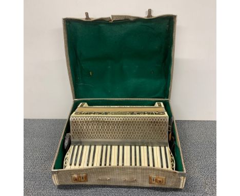 A cased Hohner piano accordion, box 56 x 47 x 23cm.