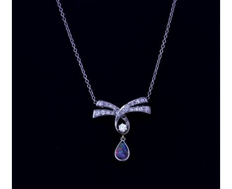 A white metal (tested minimum 9ct gold) bow shaped  necklace set with a brilliant cut diamond and opal triplet, L. 2.4cm.