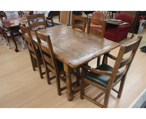 A contemporary oak dining table and six chairs, distressed, the chairs of ladder back form, leatherette seats, 77cm high, 166
