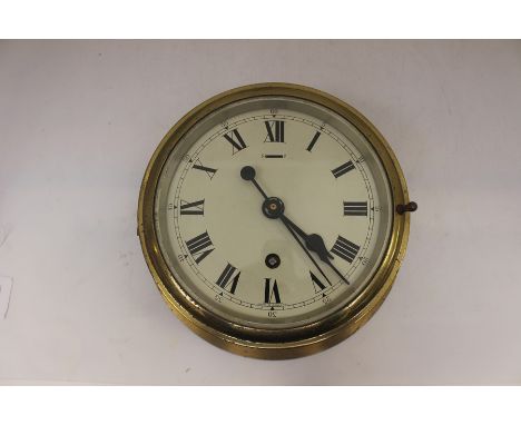 Brass early 20th Century ships clock, with key, in working order