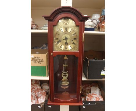 A modern German wall clock, by AMS, with gilt arched dial, Roman numerals, stained wood case, 80cm long 