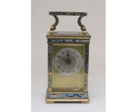 Small early 20th Century French carriage clock with enamelled panels and handle, small silvered round face with Arabic numera