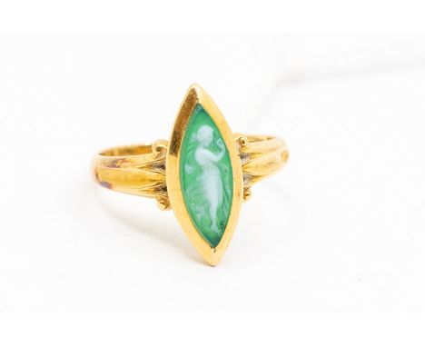 A Wedgewood green jasperware and 18ct gold ring, comprising a marquise shaped jasperware to scrolled shoulders, size M, total