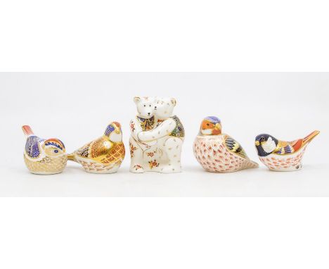 Three Royal Crown Derby gold stopper paperweights of birds, along with one silver stopper and teddy bear