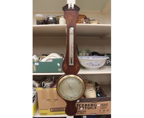 A 19th Century mahogany banjo barometer and thermometer, having a circular dial and inlaid decoration