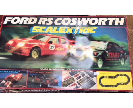 Scalextric: Two set, Ford Cosworth and G.P.3. In used condition, incomplete. Please see images for contents and condition.