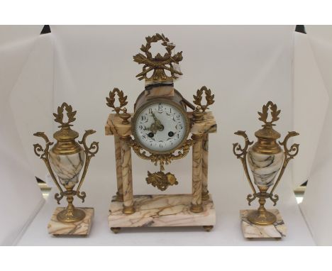 A late 19th Century E M Paris garniture clock set, in white veined marble comprising 8 day mantle clock raised on four column