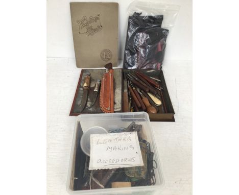A collection of leather making accessories and vintage wooden handled tools with vintage books along with two sheaf knives&nb