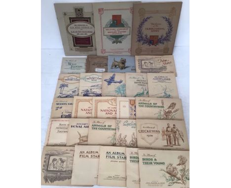 Collection of cigarette card albums to include Military Uniforms, Territorial Army, Howlers, Air Liners, Fresh Water Fish, Wi