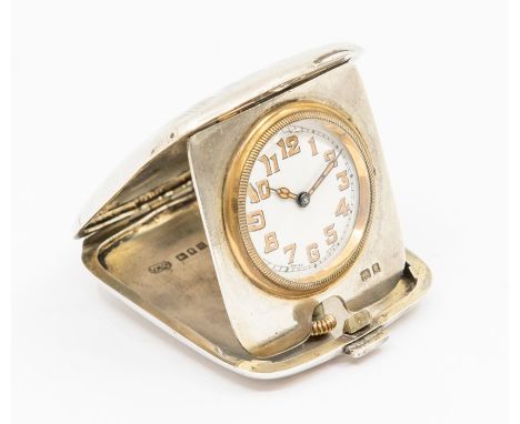 An Art Deco  silver cased miniature travel clock, white enamel dial, approx 25mm, gold tone painted Arabic markers, to a silv