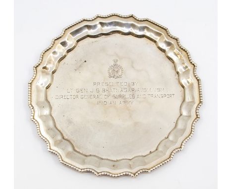An Indian silver shaped circular presentation card tray, beaded rim, the centre engraved: Presented by Lt Gen JS Bhatnagar AV