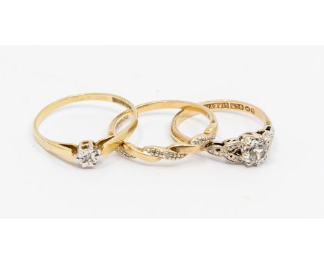 Three 9ct gold stone set rings, including a small diamond set solitaire, size P, a diamond set twist ring, size O, along with